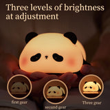 Panda LED night light held in hands showing three brightness levels — first gear, second gear, and three gear